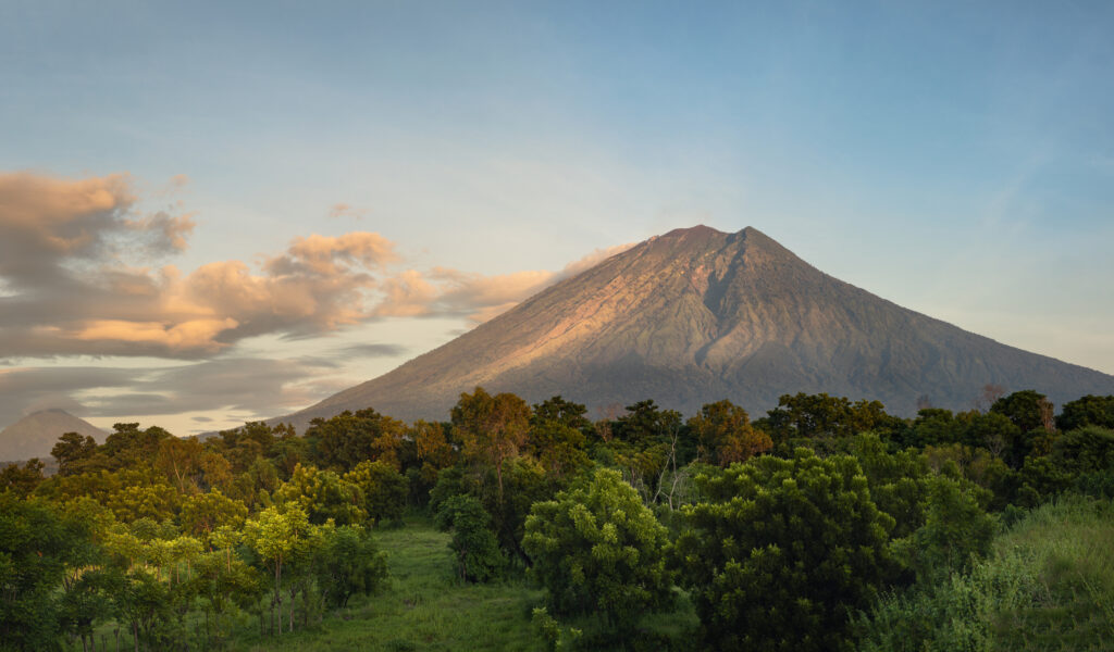 Rural landscape and tropical nature overlooking magnificent sunrise and mount Agung volcano on Bali island, Karangasem district